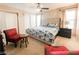 Bedroom featuring ceiling fan, natural light and ensuite bathroom at 9552 Wooden Pier Way, Las Vegas, NV 89117