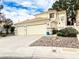 Charming two-story home featuring a spacious three-car garage and landscaped front yard at 9552 Wooden Pier Way, Las Vegas, NV 89117