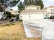 Inviting two-story home features a three-car garage and a cozy front yard at 9552 Wooden Pier Way, Las Vegas, NV 89117