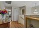 Hallway with hardwood floors, a chandelier, and ample closet space at 9552 Wooden Pier Way, Las Vegas, NV 89117