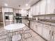 Modern kitchen boasts stainless steel appliances, granite countertops, and ample cabinet space at 9552 Wooden Pier Way, Las Vegas, NV 89117