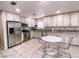Modern kitchen boasts stainless steel appliances, granite countertops, and ample cabinet space at 9552 Wooden Pier Way, Las Vegas, NV 89117