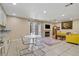 Cozy living room area featuring a fireplace and a dining table near the kitchen at 9552 Wooden Pier Way, Las Vegas, NV 89117