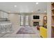 Open concept living room with access to the backyard and modern decor at 9552 Wooden Pier Way, Las Vegas, NV 89117