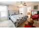 Spacious main bedroom offers a ceiling fan, natural light and ensuite bathroom at 9552 Wooden Pier Way, Las Vegas, NV 89117