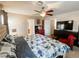 This primary bedroom suite has neutral color palette, ceiling fan and ensuite bathroom at 9552 Wooden Pier Way, Las Vegas, NV 89117