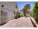 Private backyard patio area with mature landscaping at 9552 Wooden Pier Way, Las Vegas, NV 89117