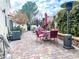 Spacious patio area with brick pavers has various seating arrangements, perfect for outdoor entertaining and relaxation at 9552 Wooden Pier Way, Las Vegas, NV 89117