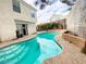 A private in-ground backyard pool offers a relaxing escape from the summer heat at 9552 Wooden Pier Way, Las Vegas, NV 89117