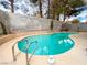 Backyard swimming pool with ladder offers a refreshing oasis for relaxation and recreation at 9552 Wooden Pier Way, Las Vegas, NV 89117