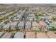 Aerial view showing neighborhood, landscaping, streets, and nearby hills at 9872 Chief Sky St, Las Vegas, NV 89178