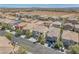 Aerial view of neighborhood, landscaping, and nearby mountains on the horizon at 9872 Chief Sky St, Las Vegas, NV 89178
