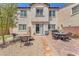Well maintained backyard with patio, desert landscaping, and slider to home at 9872 Chief Sky St, Las Vegas, NV 89178
