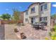 The private backyard offers an outdoor dining set and covered patio at 9872 Chief Sky St, Las Vegas, NV 89178