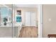 Bright bathroom featuring a tub, shower, linen closet, and wood-look floors at 9872 Chief Sky St, Las Vegas, NV 89178