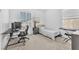 Bedroom features a work area, keyboard, and a neutral color palette at 9872 Chief Sky St, Las Vegas, NV 89178