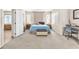 Spacious carpeted bedroom with good natural light, desk area and entry view at 9872 Chief Sky St, Las Vegas, NV 89178