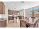Modern eat-in kitchen with stainless steel appliances, island, and direct access to the backyard at 9872 Chief Sky St, Las Vegas, NV 89178