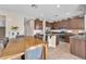 Eat-in kitchen featuring stainless appliances, tile floors, lots of storage, and center island at 9872 Chief Sky St, Las Vegas, NV 89178