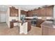 Well-designed eat-in kitchen with stainless steel appliances, lots of storage, and tile floors at 9872 Chief Sky St, Las Vegas, NV 89178