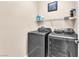 A well-equipped laundry room features new washer and dryer at 9872 Chief Sky St, Las Vegas, NV 89178