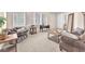 The living room is a bright and cozy space with plenty of room to relax and unwind at 9872 Chief Sky St, Las Vegas, NV 89178