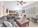 Bright, open-concept living room with large windows and easy access to the spacious kitchen at 9872 Chief Sky St, Las Vegas, NV 89178