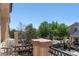 View from the balcony overlooking a greenbelt featuring mature trees and privacy at 9962 Derby Creek Way, Las Vegas, NV 89148