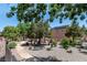 Scenic view of community park with mature trees, walking paths, and benches at 9962 Derby Creek Way, Las Vegas, NV 89148