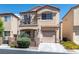 Charming two-story home with a balcony, low maintenance yard, and attached garage at 9962 Derby Creek Way, Las Vegas, NV 89148