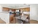 Well-equipped kitchen with stainless steel appliances, granite countertops, and dark wood cabinetry at 9962 Derby Creek Way, Las Vegas, NV 89148