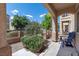 Cozy front porch sitting area to enjoy the exterior neighborhood views at 9962 Derby Creek Way, Las Vegas, NV 89148