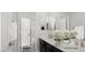 Bathroom with dual sinks, a walk-in shower, and modern finishes at 1015 Solana Crest St, Henderson, NV 89052