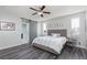 Bright bedroom offers wood floors, natural light, and a sliding barn door at 1015 Solana Crest St, Henderson, NV 89052