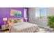 Bedroom features a plush bed, decorative pillows, and stylish decor accents at 1015 Solana Crest St, Henderson, NV 89052
