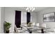 Dining room with a glass-top table, seating for six, and elegant lighting at 1015 Solana Crest St, Henderson, NV 89052