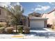 Charming single-story home with stone accents and a well-manicured lawn at 1015 Solana Crest St, Henderson, NV 89052