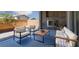 Covered patio featuring a stone fireplace and comfortable outdoor seating at 1015 Solana Crest St, Henderson, NV 89052