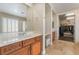 Bright bathroom featuring dual vanities, a walk-in shower, and a separate soaking tub at 10370 Sweet Laurel St St, Las Vegas, NV 89178