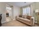 Cozy bedroom sitting area with comfortable seating and natural light from shuttered windows at 10370 Sweet Laurel St St, Las Vegas, NV 89178