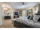 Elegant bedroom with a tray ceiling, chandelier, and inviting decor at 10370 Sweet Laurel St St, Las Vegas, NV 89178