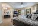 Elegant bedroom with a tray ceiling, chandelier, and inviting decor at 10370 Sweet Laurel St St, Las Vegas, NV 89178