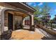 Inviting front porch with stylish seating and decorative planters at 10370 Sweet Laurel St St, Las Vegas, NV 89178