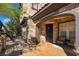 Elegant front porch with stone accents, comfortable seating, and decorative plants at 10370 Sweet Laurel St St, Las Vegas, NV 89178