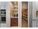 Convenient kitchen coffee bar plus a walk-in pantry with shelving and a frosted glass door at 10370 Sweet Laurel St St, Las Vegas, NV 89178