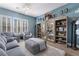 Cozy living room with modern decor, stylish furniture, and a decorative chandelier at 10370 Sweet Laurel St St, Las Vegas, NV 89178