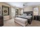 Relaxing main bedroom featuring a king-size bed with elegant linens and decorative wall art at 10370 Sweet Laurel St St, Las Vegas, NV 89178