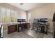 Well-lit home office featuring a large desk, multiple monitors, and comfortable seating at 10370 Sweet Laurel St St, Las Vegas, NV 89178
