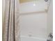 Clean bathroom shower with white tiled walls and silver hardware at 10370 Sweet Laurel St St, Las Vegas, NV 89178