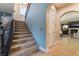 Beautiful staircase featuring carpeted steps and a wrought iron railing leading to the second floor at 10370 Sweet Laurel St St, Las Vegas, NV 89178